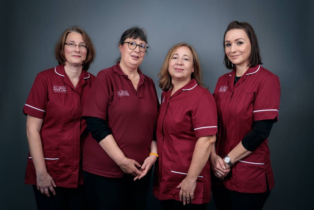 Four All About Home Care carers in uniform